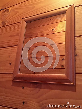 Brown frame mirror timber wall Stock Photo