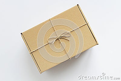 Brown gift box hank of rope white background Stock Photo