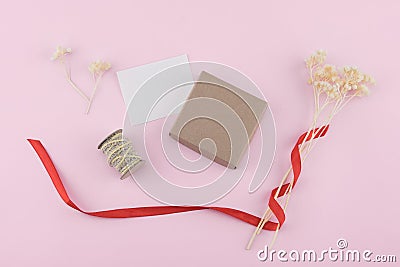 Brown gift box with white dried flowers and pinecones Stock Photo