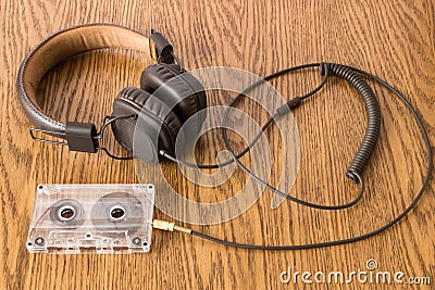 Brown headphones with long rubber cable connected Stock Photo