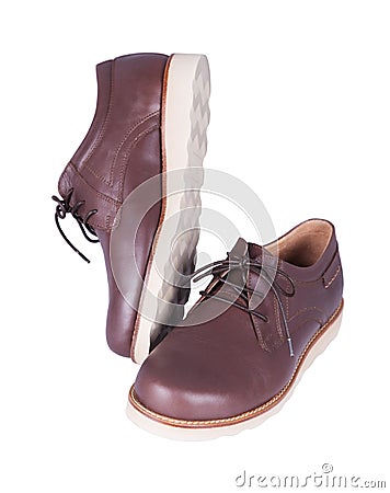 Brown leather men`s shoes isolated on a white Stock Photo