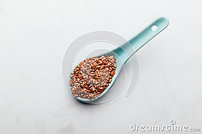 Brown Linseeds in spoon Stock Photo