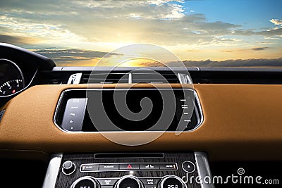 Brown luxury modern car Interior. Steering wheel shift lever and dashboard. Detail of modern car interior. Automatic gear stick. Stock Photo