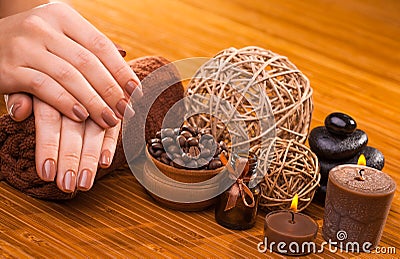 Brown manicure on a bamboo background Stock Photo