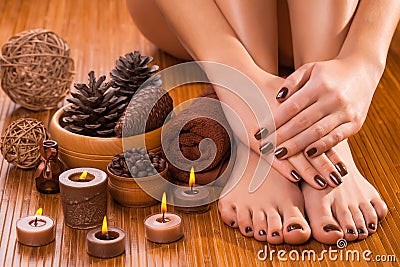 Brown manicure and pedicure on the white Stock Photo
