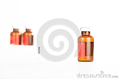 Brown medicine ampule on white Stock Photo
