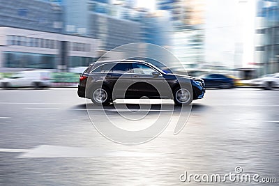 Brown Mercedes GLC 350d car fast speed drive on city road Editorial Stock Photo