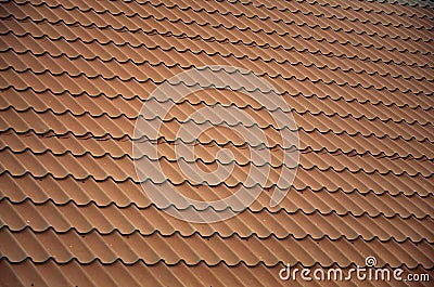 Brown metal roof tiles. Metal Roof Shingles - Roofing Constructi Stock Photo