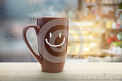 Brown mug of coffee with a happy smile. Stock Photo