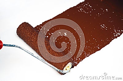 Brown paint roller Stock Photo