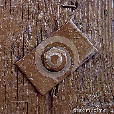 Brown painted old wood background with bolt and square metal detail Stock Photo