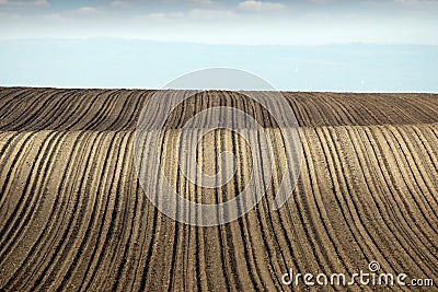 Brown plowed field farmland landscape Stock Photo
