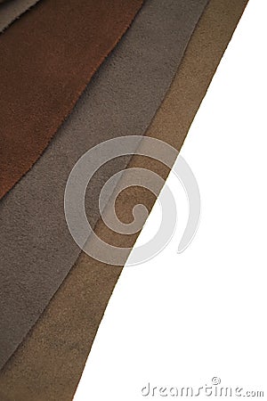 Brown real leather mixed set isolated on white background.Natural leather texture close-up.Material for shoes, clothing Stock Photo