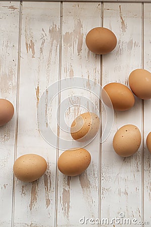 Brown or red chicken eggs, vertical image, wooden shabby background Stock Photo