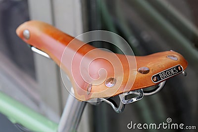 Brown Retro Style Saddle of a Bike Editorial Stock Photo