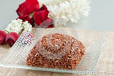 Thai brown rice on dish Stock Photo