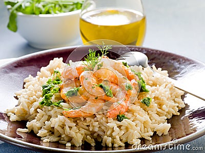 Brown rice with shrimp and arugula Stock Photo