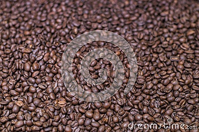 Brown roasted coffee beans, grained arabica coffee background. Espresso dark, aroma, black caffeine drink. Closeup isolated energy Stock Photo