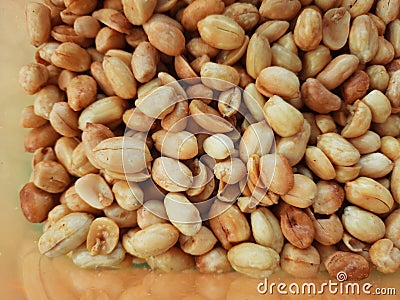 Brown salty crispy fried peanuts Stock Photo