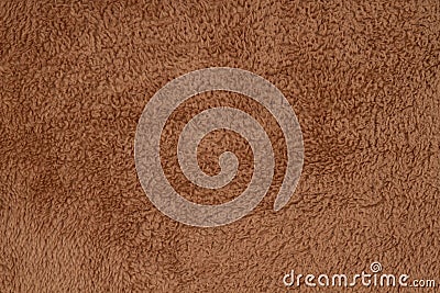 Brown sherpa textured plush fabric material background Stock Photo