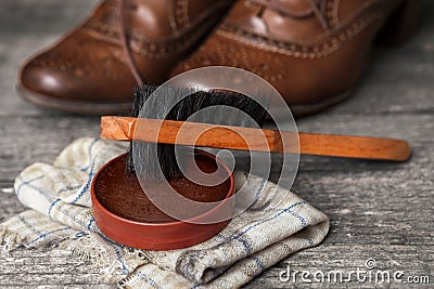 Brown shoes with brush and polish cream Stock Photo