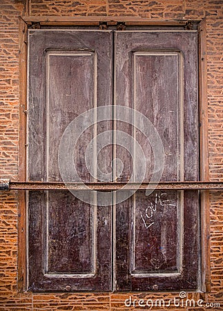 Brown shutter of a moroccan building Stock Photo