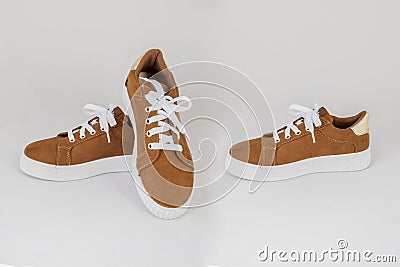 Brown sneakers shoes isolated on white background Stock Photo