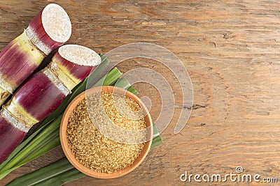 Brown sugar and cane on the table top view Stock Photo