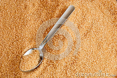 Brown sugar in a spoon. Stock Photo