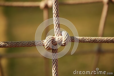 Brown Twisted Rope of climbing net in the playground. Rope knot Stock Photo