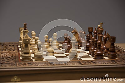 Brown and white figures on chess desk Stock Photo