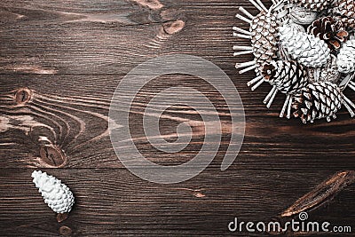 Brown wood background with texture. Decorative fir cones. Fellowship, New Year and Xmas. Stock Photo