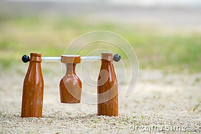 Brown woodball gate or finish line on sand ground floor. Stock Photo