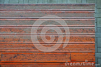 Brown wooden terrace at the entrance to the house. entrance staircase. the coating of the boards with serrations is in the shade o Stock Photo