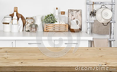 Brown wooden texture table over blurred image of kitchen bench Stock Photo