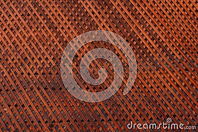 Brown wooden wall lattice background texture. wooden fence cross pattern. Crossing a tree with nails Stock Photo