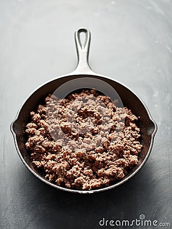 Browned ground beef in cast iron skillet Stock Photo