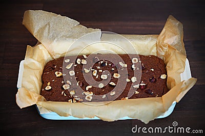 Brownie cake with hazelnuts in ceramic baking dish Stock Photo
