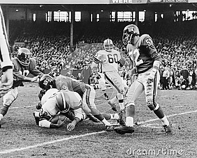 Browns legend Jim Brown getting tackled by the NY Giants Editorial Stock Photo
