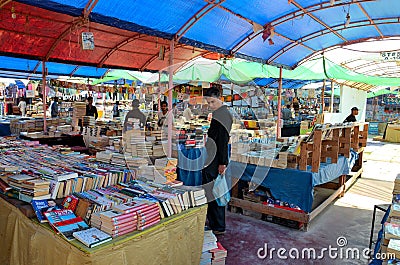 Browsing books at stall in bazaar Karachi Pakistan Editorial Stock Photo