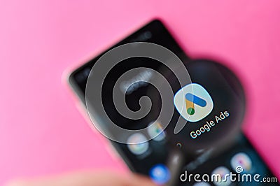 Browsing Google ads app on smartphone Editorial Stock Photo