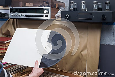 Browsing through vinyl records collection. Music background. Copy space. Retro styled image Stock Photo