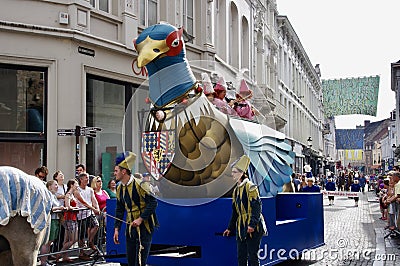 Marchers with a giant bird float in The Procession of the Golden Tree Pageant, held every 5 years since 1958. Editorial Stock Photo