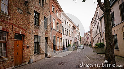 Bruges, Belgium - May 12, 2018: Roofs And Windows Of Old Authentic Brick Houses On Street Ontvangers-straat Editorial Stock Photo