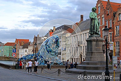 Brugge plastic whale near the monument of Jan van Eyck Editorial Stock Photo