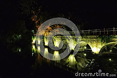 Brugge night view with a canal and old bridge, Belgium Stock Photo