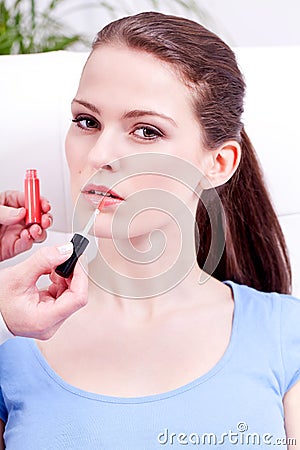 Woman applying lipstick on lips natural beauty Stock Photo