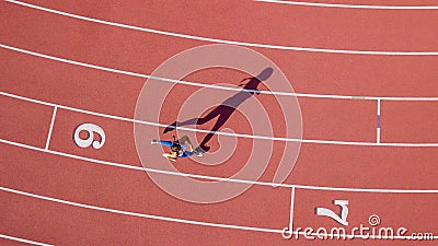 Brunette Fitness Model Running On A Track Stock Photo