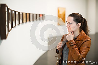 Brunette girl in art museum Stock Photo