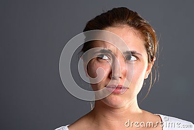 Brunette girl confused Stock Photo